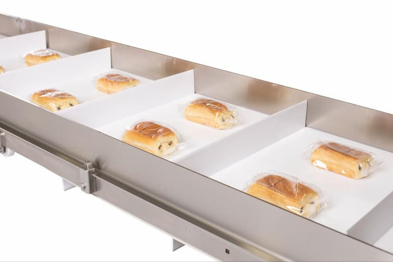 A Dorner AquaGard conveyor transports packaged croissants.